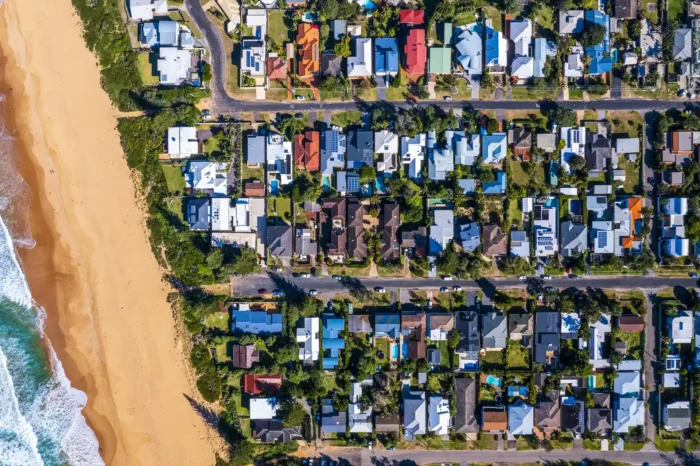 Drone shot of grid formatted neighbourhood structure on coast in Australian residential suburb 